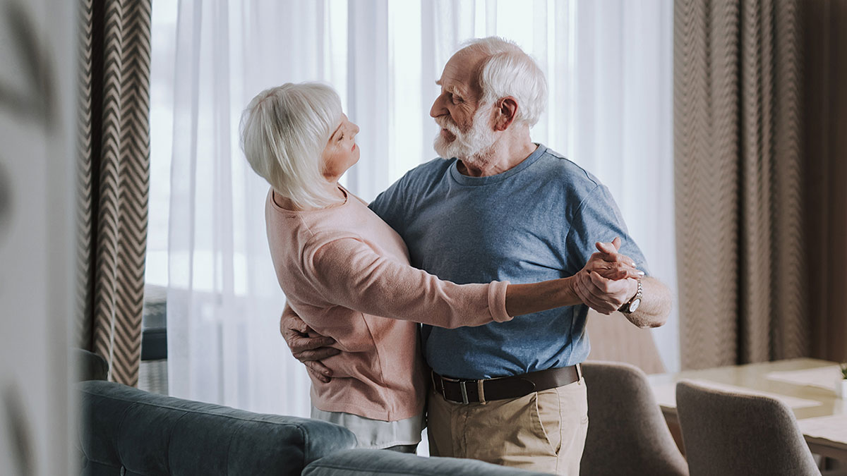 An older couple dancing in a Lovell home