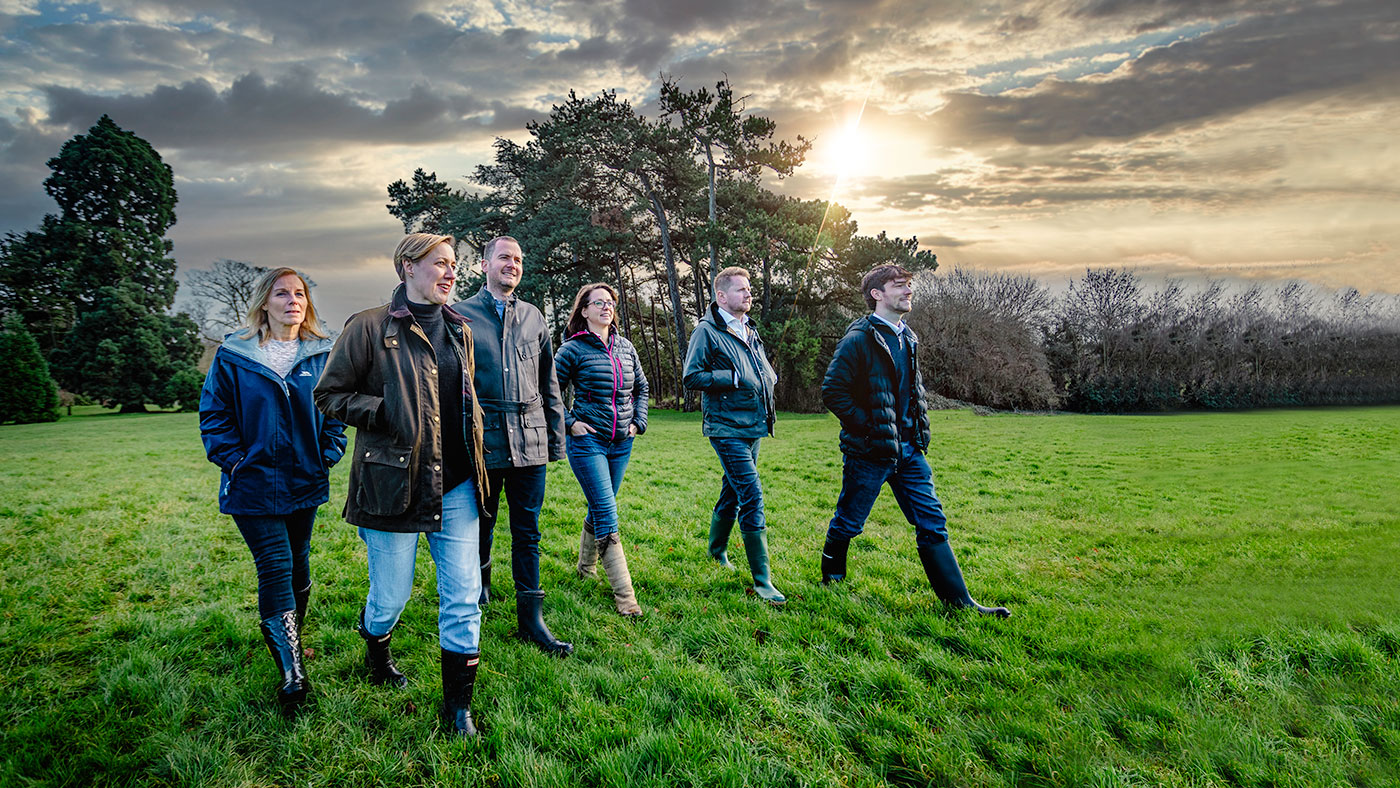 A group of people walking across land